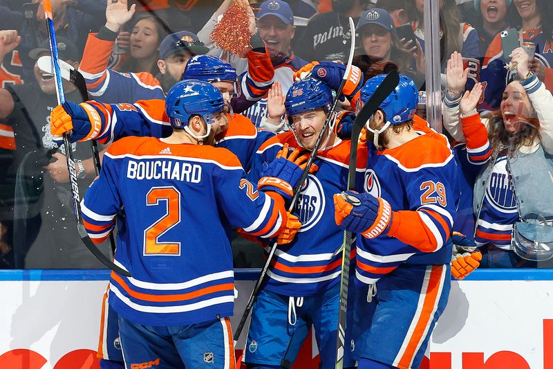 May 18, 2024; Edmonton, Alberta, CAN; The Edmonton Oilers celebrate a goal scored by forward Dylan Holloway (55) during the first period against the Vancouver Canucks in game six of the second round of the 2024 Stanley Cup Playoffs at Rogers Place. Mandatory Credit: Perry Nelson-USA TODAY Sports