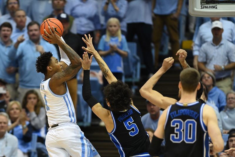 Mar 4, 2023; Chapel Hill, North Carolina, USA;  North Carolina Tar Heels forward Leaky Black (1) shoots as Duke Blue Devils guard Tyrese Proctor (5) defends in the first half at Dean E. Smith Center. Mandatory Credit: Bob Donnan-USA TODAY Sports