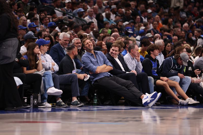 DALLAS, TEXAS - MARCH 13: Dirk Nowitzki (L) laughs while sitting next to Dallas Mavericks governor Patrick Dumont (R) in the first half against the Golden State Warriors at American Airlines Center on March 13, 2024 in Dallas, Texas. NOTE TO USER: User expressly acknowledges and agrees that, by downloading and or using this photograph, User is consenting to the terms and conditions of the Getty Images License Agreement. (Photo by Tim Heitman/Getty Images)
