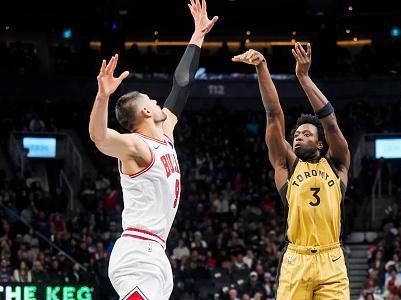 TORONTO, ON - NOVEMBER 24: OG Anunoby #3 of the Toronto Raptors shoots against Nikola Vucevic #9 of the Chicago Bulls during the first half of their NBA In-Season Tournament game at the Scotiabank Arena on November 24, 2023 in Toronto, Ontario, Canada. NOTE TO USER: User expressly acknowledges and agrees that, by downloading and/or using this Photograph, user is consenting to the terms and conditions of the Getty Images License Agreement. (Photo by Mark Blinch/Getty Images)