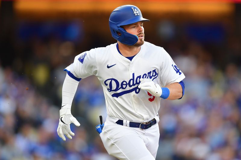 May 4, 2024; Los Angeles, California, USA; Los Angeles Dodgers second baseman Gavin Lux (9) runs after hitting a single against the Atlanta Braves during the second inning at Dodger Stadium. Mandatory Credit: Gary A. Vasquez-USA TODAY Sports