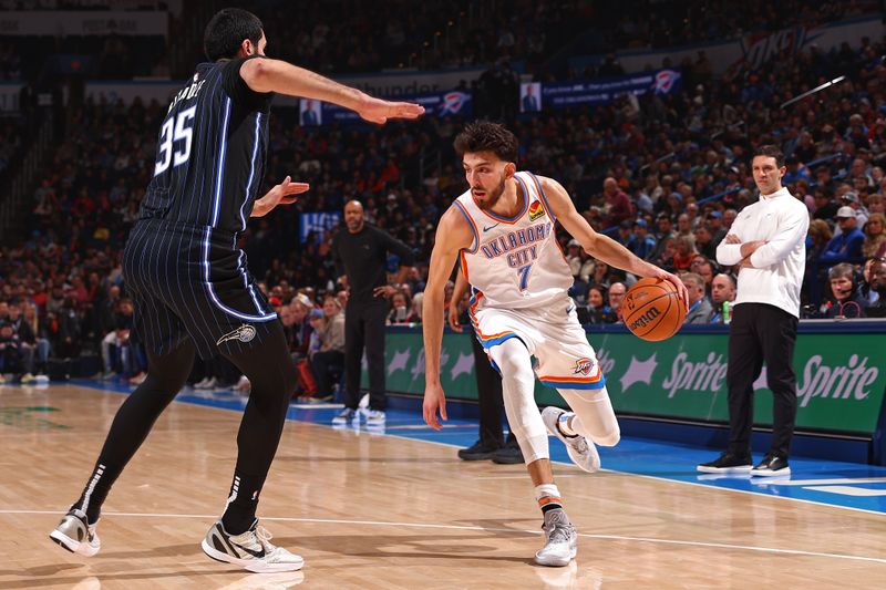 OKLAHOMA CITY, OK - JANUARY 13: Chet Holmgren #7 of the Oklahoma City Thunder handles the ball during the game against the Orlando Magic on January 13, 2024 at Paycom Arena in Oklahoma City, Oklahoma. NOTE TO USER: User expressly acknowledges and agrees that, by downloading and or using this photograph, User is consenting to the terms and conditions of the Getty Images License Agreement. Mandatory Copyright Notice: Copyright 2024 NBAE (Photo by Zach Beeker/NBAE via Getty Images)