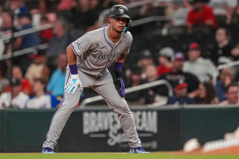 Sep 5, 2024; Cumberland, Georgia, USA; Colorado Rockies shortstop Ezequiel Tovar (14) leads off of first base against the Atlanta Braves during the eighth inning at Truist Park. Mandatory Credit: Dale Zanine-Imagn Images