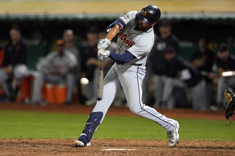 Sep 6, 2024; Oakland, California, USA; Detroit Tigers left fielder Riley Greene (31) hits an RBI single against the Oakland Athletics during the twelfth inning at Oakland-Alameda County Coliseum. Mandatory Credit: Darren Yamashita-Imagn Images