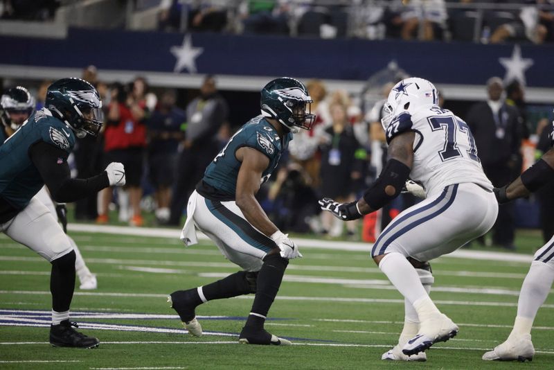 Philadelphia Eagles defensive end Josh Sweat (94) rushes Dallas Cowboys offensive tackle Tyron Smith (77) during an NFL Football game in Arlington, Texas, Sunday, Dec. 10, 2023. (AP Photo/Michael Ainsworth)