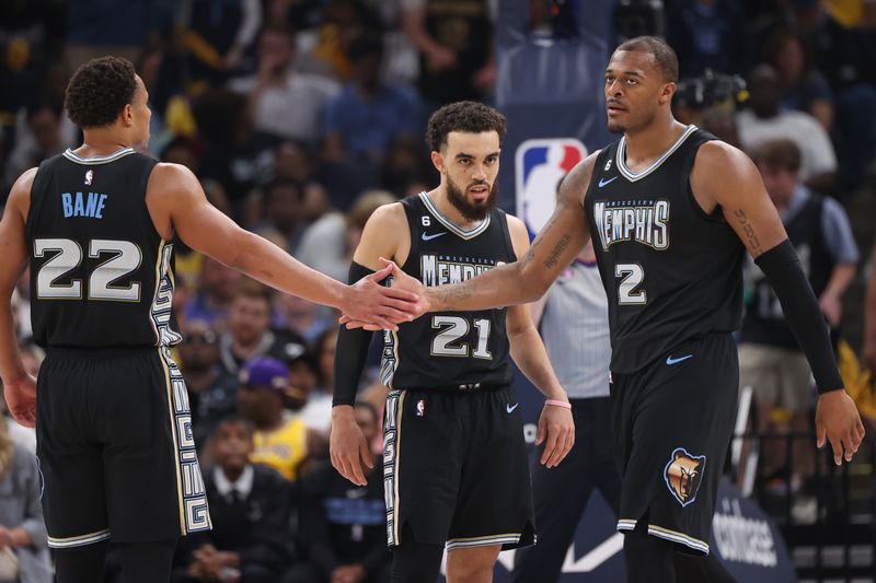 MEMPHIS, TN - APRIL 19: Desmond Bane #22 high fives Xavier Tillman #2 of the Memphis Grizzlies during Round One Game Two of the 2023 NBA Playoffs against the Los Angeles Lakers on April 19, 2023 at FedExForum in Memphis, Tennessee. NOTE TO USER: User expressly acknowledges and agrees that, by downloading and or using this photograph, User is consenting to the terms and conditions of the Getty Images License Agreement. Mandatory Copyright Notice: Copyright 2023 NBAE (Photo by Joe Murphy/NBAE via Getty Images)