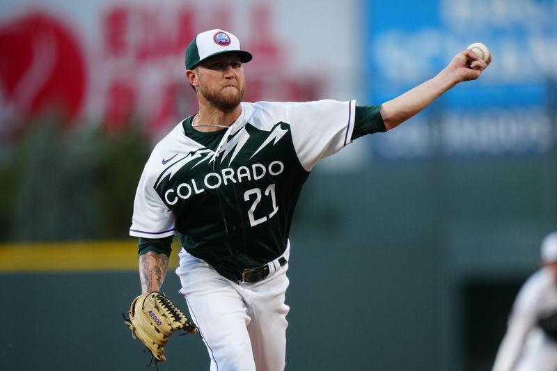 Aug 30, 2023; Denver, Colorado, USA;  Colorado Rockies starting pitcher Kyle Freeland (21) delivers a pitch in the first inning against the Atlanta Braves at Coors Field. Mandatory Credit: Ron Chenoy-USA TODAY Sports