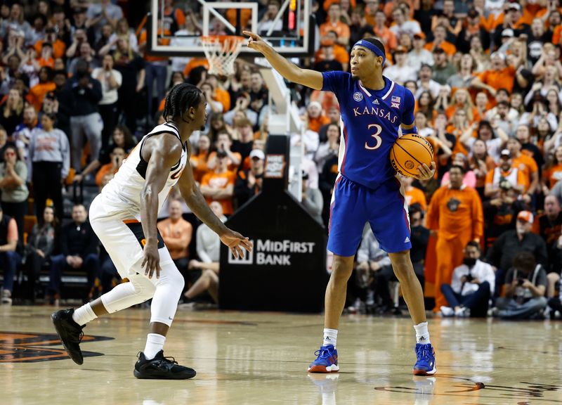 Feb 14, 2023; Stillwater, Oklahoma, USA; Kansas Jayhawks guard Dajuan Harris Jr. (3) gestures to his team on a play against the Oklahoma State Cowboys during the second half at Gallagher-Iba Arena. Kansas won 87-76. Mandatory Credit: Alonzo Adams-USA TODAY Sports