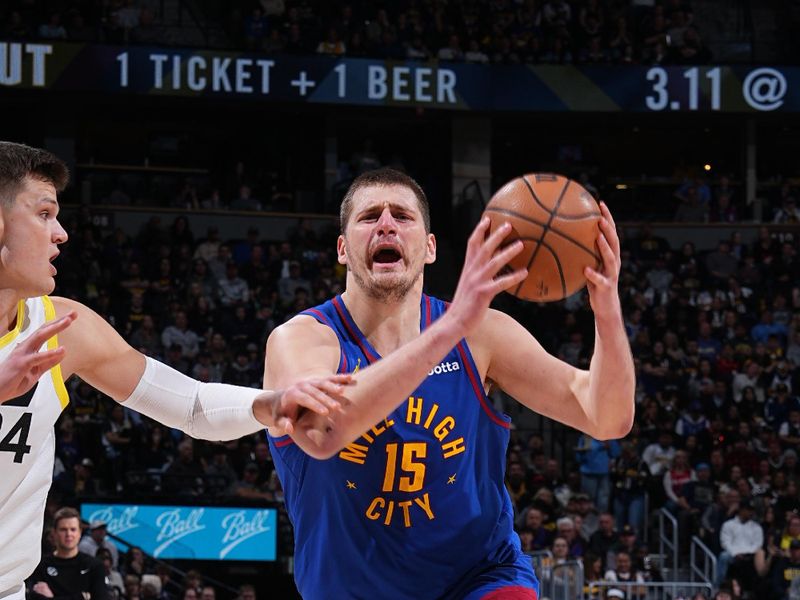 DENVER, CO - MARCH 9: Nikola Jokic #15 of the Denver Nuggets drives to the basket during the game against the Utah Jazz on March 9, 2024 at the Ball Arena in Denver, Colorado. NOTE TO USER: User expressly acknowledges and agrees that, by downloading and/or using this Photograph, user is consenting to the terms and conditions of the Getty Images License Agreement. Mandatory Copyright Notice: Copyright 2024 NBAE (Photo by Garrett Ellwood/NBAE via Getty Images)