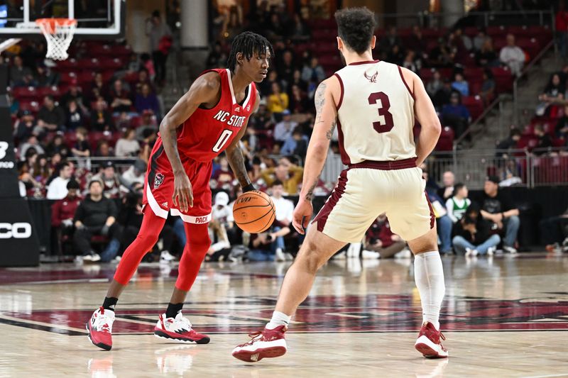 Feb 11, 2023; Chestnut Hill, Massachusetts, USA; North Carolina State Wolfpack guard Terquavion Smith (0) dribbles the ball against Boston College Eagles guard Jaeden Zackery (3) during the second half at the Conte Forum. Mandatory Credit: Brian Fluharty-USA TODAY Sports