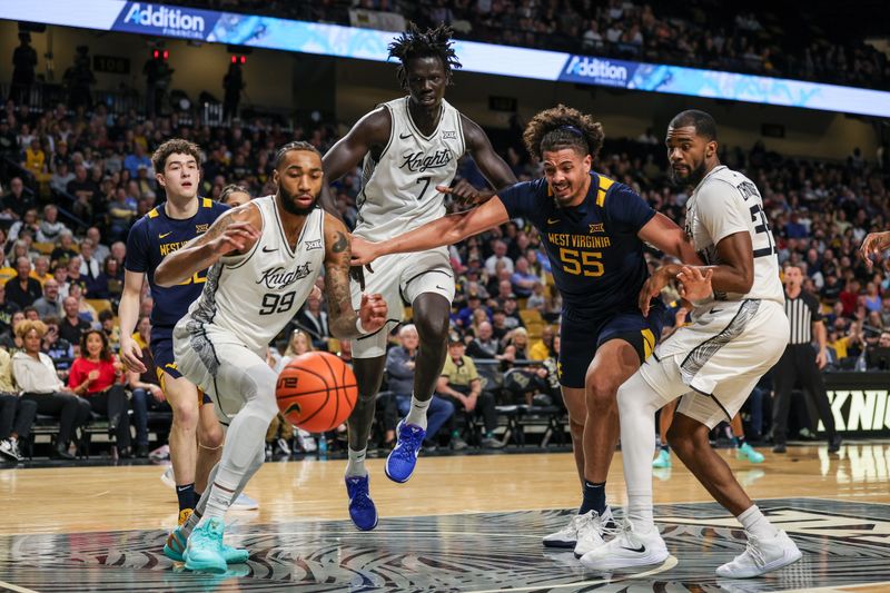 Feb 14, 2026; Orlando, Florida, USA; UCF Knights forward Jordan Burks (99) chases the rebound during the first half against the West Virginia Mountaineers at Addition Financial Arena. Mandatory Credit: Mike Watters-Imagn Images