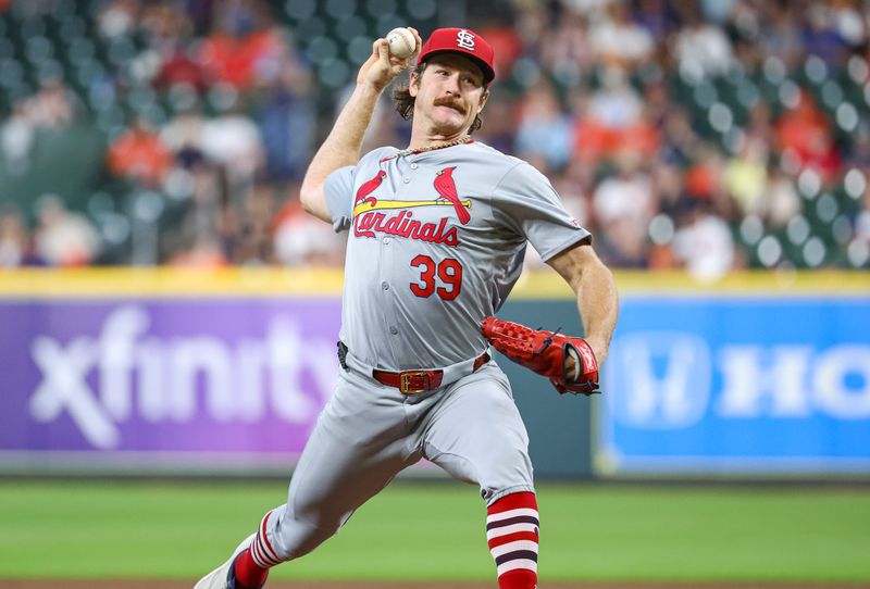 Jun 5, 2024; Houston, Texas, USA; St. Louis Cardinals starting pitcher Miles Mikolas (39) delivers a pitch during the second inning against the Houston Astros at Minute Maid Park. Mandatory Credit: Troy Taormina-USA TODAY Sports