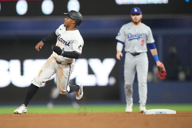 Sep 17, 2024; Miami, Florida, USA;  Miami Marlins shortstop Xavier Edwards (63) heads from first to third base on a base hit in the first inning against the Los Angeles Dodgers at loanDepot Park. Mandatory Credit: Jim Rassol-Imagn Images