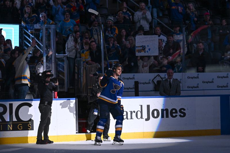 Jan 16, 2025; St. Louis, Missouri, USA; St. Louis Blues center Brayden Schenn (10) acknowledges fans after being named the first star of the game after beating the Calgary Flames 4-1 in the third period at Enterprise Center. Mandatory Credit: Joe Puetz-Imagn Images