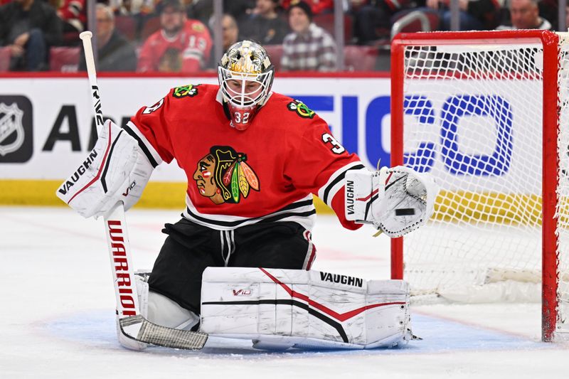 Mar 6, 2023; Chicago, Illinois, USA;  Chicago Blackhawks goaltender Alex Stalock (32) follows the puck on a shot from the Ottawa Senators in the third period at United Center. Mandatory Credit: Jamie Sabau-USA TODAY Sports