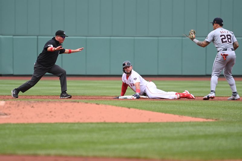 Jun 2, 2024; Boston, Massachusetts, USA;  Boston Red Sox right fielder Wilyer Abreu (52) slides safe into second base covered by Detroit Tigers shortstop Javier Baez (28) during the first inning at Fenway Park. Mandatory Credit: Eric Canha-USA TODAY Sports