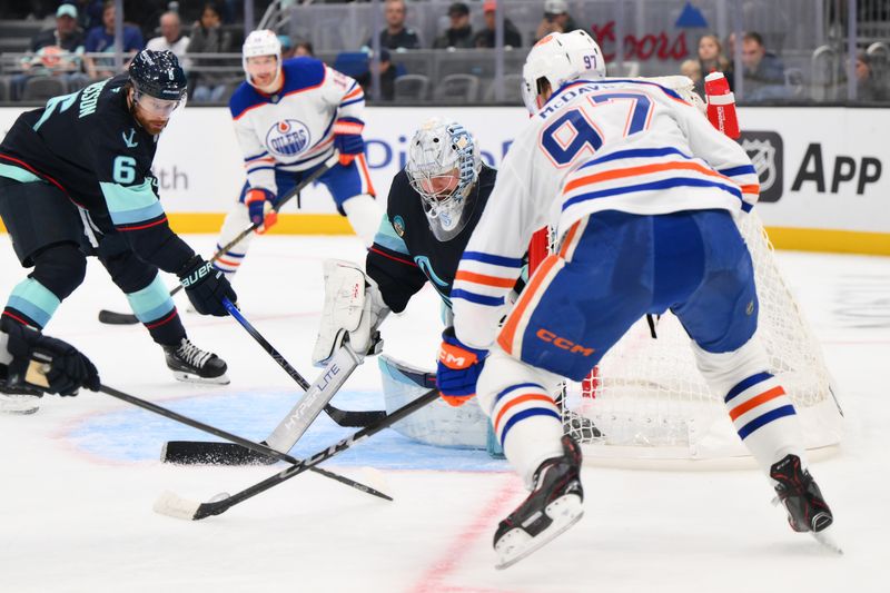 Oct 2, 2024; Seattle, Washington, USA; Seattle Kraken goaltender Philipp Grubauer (31) defends the goal from Edmonton Oilers center Connor McDavid (97) during the second period at Climate Pledge Arena. Mandatory Credit: Steven Bisig-Imagn Images