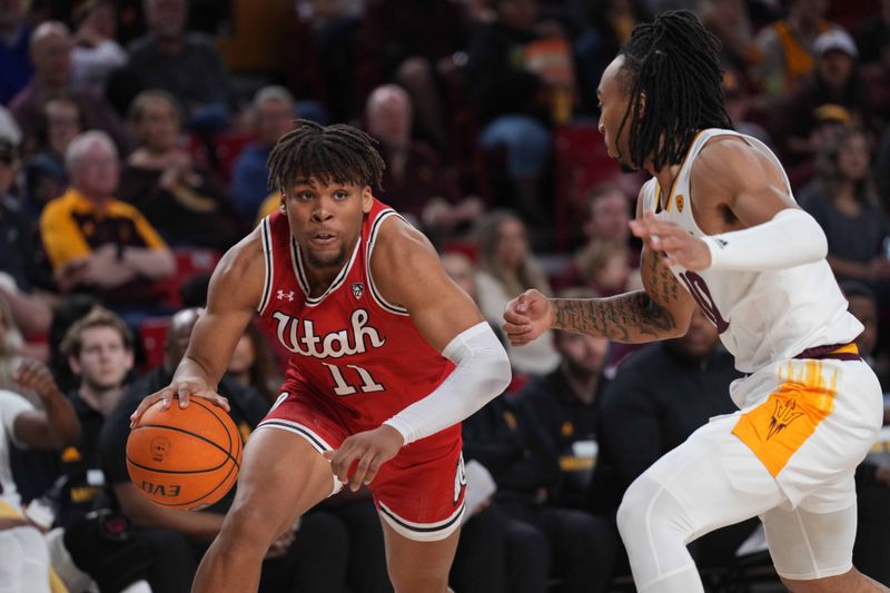 Feb 18, 2023; Tempe, Arizona, USA; Utah Utes guard Wilguens Exacte Jr. (11) dribbles against Arizona State Sun Devils guard Frankie Collins (10) during the first half at Desert Financial Arena. Mandatory Credit: Joe Camporeale-USA TODAY Sports