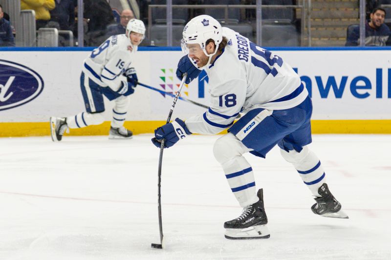 Dec 11, 2023; Elmont, New York, USA; Toronto Maple Leafs center Noah Gregor (18) take a shot against the New York Islanders during the third period period at UBS Arena. Mandatory Credit: Thomas Salus-USA TODAY Sports