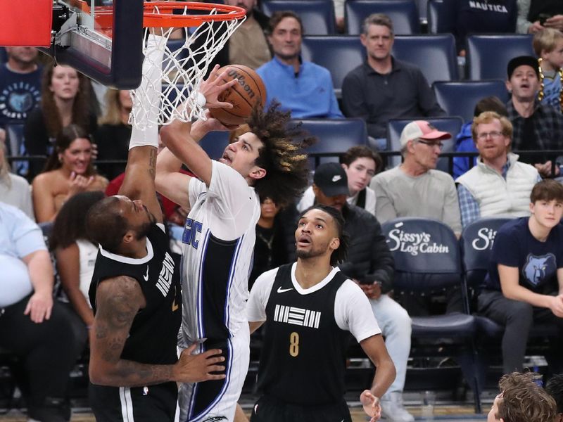 MEMPHIS, TN - JANUARY 26:  Anthony Black #0 of the Orlando Magic drives to the basket during the game against the Memphis Grizzlies  on January 26, 2024 at FedExForum in Memphis, Tennessee. NOTE TO USER: User expressly acknowledges and agrees that, by downloading and or using this photograph, User is consenting to the terms and conditions of the Getty Images License Agreement. Mandatory Copyright Notice: Copyright 2024 NBAE (Photo by Joe Murphy/NBAE via Getty Images)