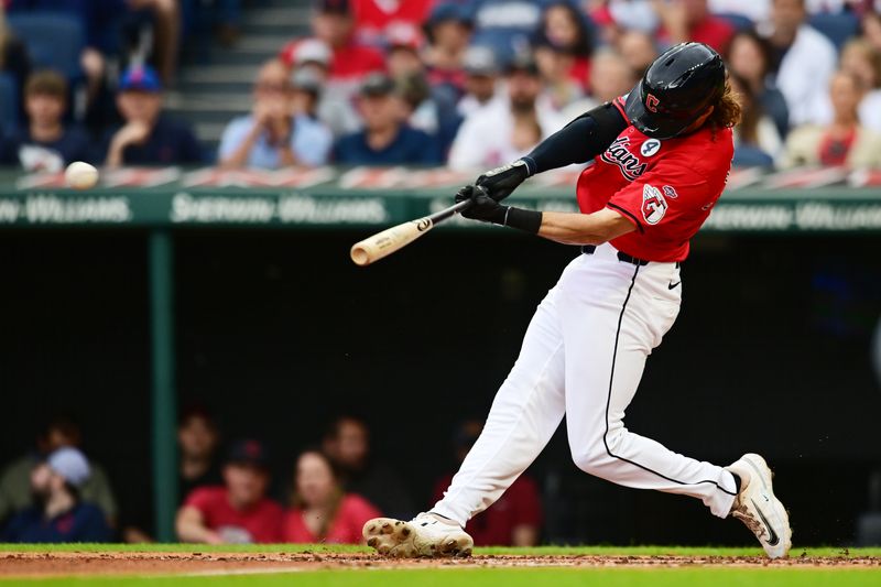 Jun 2, 2024; Cleveland, Ohio, USA; Cleveland Guardians second baseman Daniel Schneemann (10) hits an RBI double during the second inning against the Washington Nationals at Progressive Field. Mandatory Credit: Ken Blaze-USA TODAY Sports