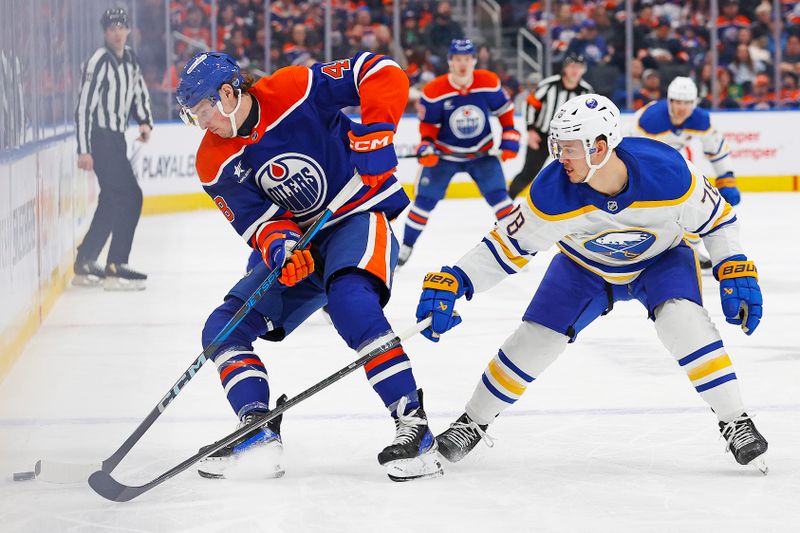 Jan 25, 2025; Edmonton, Alberta, CAN; Edmonton Oilers forward Noah Philp (48) and Buffalo Sabres defensemen Jacob Bryson (78) battle along the boards for a loose puck during the third period at Rogers Place. Mandatory Credit: Perry Nelson-Imagn Images