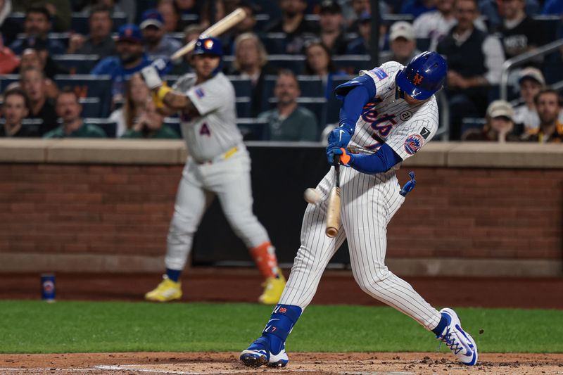 Sep 16, 2025; New York City, New York, USA; New York Mets third baseman Brett Baty (7) hits a two run home run during the first inning against the San Diego Padres at Citi Field. Mandatory Credit: Vincent Carchietta-Imagn Images