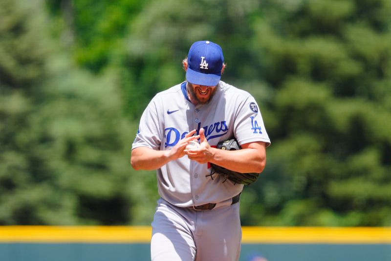 Jun 26, 2025; Denver, Colorado, USA; Los Angeles Dodgers starting pitcher Clayton Kershaw (22) prepares to delivers a pitch in the first inning against the Colorado Rockies at Coors Field. Mandatory Credit: Ron Chenoy-Imagn Images