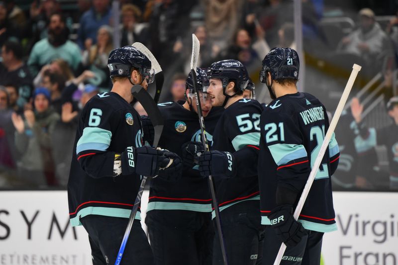 Nov 24, 2023; Seattle, Washington, USA; The Seattle Kraken celebrate after a goal scored by Seattle Kraken left wing Tye Kartye (52) during the second period against the Vancouver Canucks at Climate Pledge Arena. Mandatory Credit: Steven Bisig-USA TODAY Sports