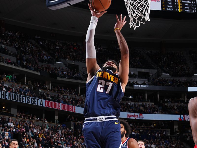 DENVER, CO - FEBRUARY 22: Jamal Murray #27 of the Denver Nuggets drives to the basket during the game against the Washington Wizards on February 22, 2024 at the Ball Arena in Denver, Colorado. NOTE TO USER: User expressly acknowledges and agrees that, by downloading and/or using this Photograph, user is consenting to the terms and conditions of the Getty Images License Agreement. Mandatory Copyright Notice: Copyright 2024 NBAE (Photo by Garrett Ellwood/NBAE via Getty Images)