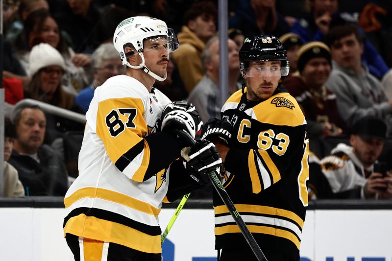 Nov 29, 2024; Boston, Massachusetts, USA; Captains, Pittsburgh Penguins center Sidney Crosby (87) and Boston Bruins left wing Brad Marchand (63) look back towards their benches as the referees sort out penalties against each team during the first period at TD Garden. Mandatory Credit: Winslow Townson-Imagn Images