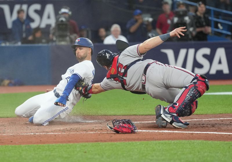 May 12, 2023; Toronto, Ontario, CAN; Toronto Blue Jays center fielder Kevin Kiermaier (39) is tagged out at home plate by Atlanta Braves catcher Sean Murphy (12) during the fifth inning at Rogers Centre. Mandatory Credit: Nick Turchiaro-USA TODAY Sports