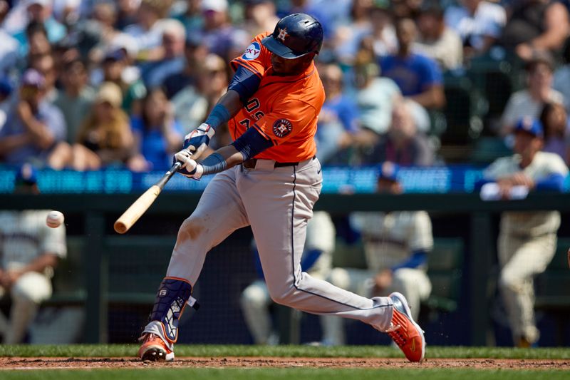 Jul 21, 2024; Seattle, Washington, USA; Houston Astros designated hitter Yordan Alvarez (44) hits a double against the Seattle Mariners during the eighth inning at T-Mobile Park. Mandatory Credit: John Froschauer-USA TODAY Sports