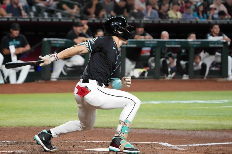 Jul 12, 2024; Phoenix, Arizona, USA; Arizona Diamondbacks outfielder Corbin Carroll (7) hits an RBI single against the Toronto Blue Jays during the third inning at Chase Field. Mandatory Credit: Joe Camporeale-USA TODAY Sports