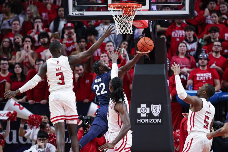 Jan 31, 2024; Piscataway, New Jersey, USA; Penn State Nittany Lions forward Qudus Wahab (22) shoots the ball as Rutgers Scarlet Knights forward Mawot Mag (3) and center Clifford Omoruyi (11) and forward Aundre Hyatt (5) defend during the second half at Jersey Mike's Arena. Mandatory Credit: Vincent Carchietta-USA TODAY Sports