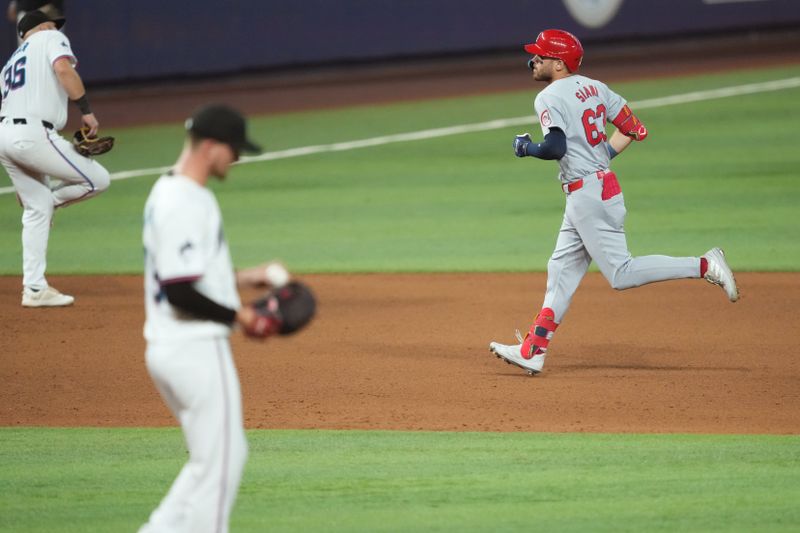 Jun 17, 2024; Miami, Florida, USA;  St. Louis Cardinals center fielder Michael Siani (63) rounds the bases after hitting a solo home run in the fifth inning against the Miami Marlins at loanDepot Park. Mandatory Credit: Jim Rassol-USA TODAY Sports