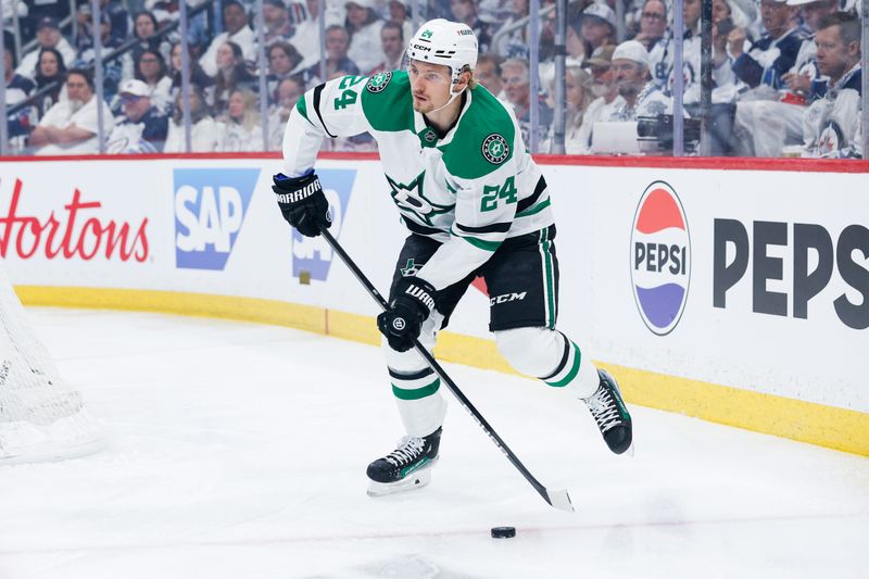 May 7, 2025; Winnipeg, Manitoba, CAN; Dallas Stars forward Roope Hintz (24) looks to make a pass against the Winnipeg Jets during the first period in game one of the second round of the 2025 Stanley Cup Playoffs at Canada Life Centre. Mandatory Credit: Terrence Lee-Imagn Images