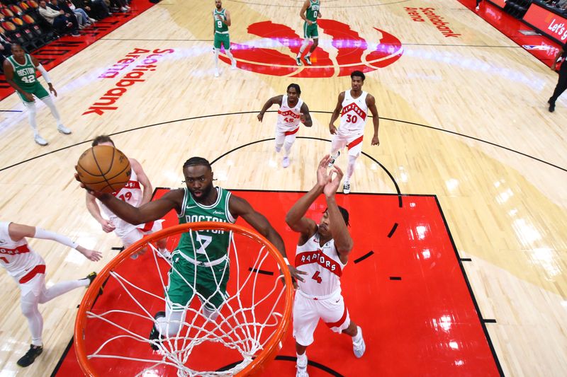 TORONTO, CANADA - OCTOBER 15: Jaylen Brown #7 of the Boston Celtics drives to the basket during the game against the Toronto Raptors on October 15, 2024 at the Scotiabank Arena in Toronto, Ontario, Canada.  NOTE TO USER: User expressly acknowledges and agrees that, by downloading and or using this Photograph, user is consenting to the terms and conditions of the Getty Images License Agreement.  Mandatory Copyright Notice: Copyright 2024 NBAE (Photo by Vaughn Ridley/NBAE via Getty Images)