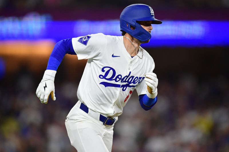 Jun 12, 2024; Los Angeles, California, USA; Los Angeles Dodgers third baseman Cavan Biggio (6) runs after hitting a single against the Texas Rangers during the fifth inning at Dodger Stadium. Mandatory Credit: Gary A. Vasquez-USA TODAY Sports