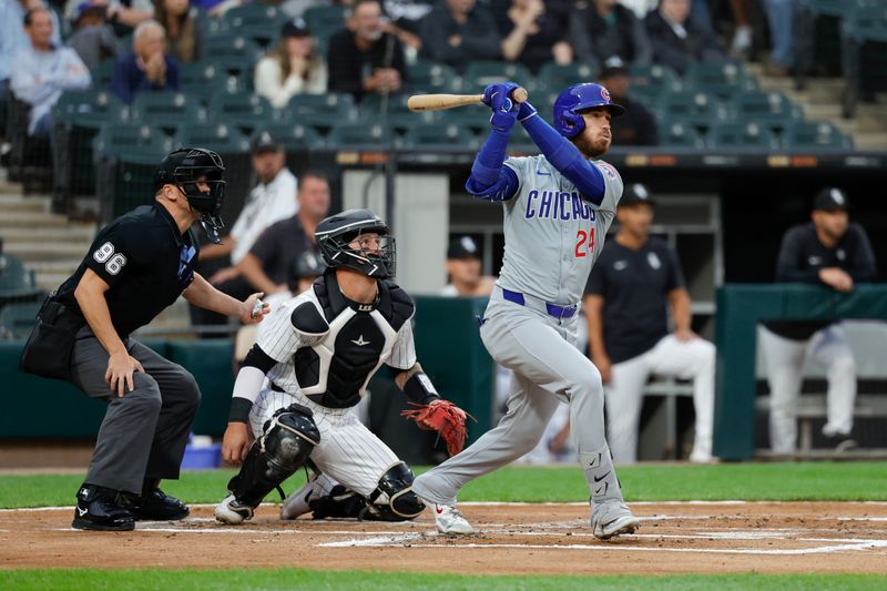 Aug 9, 2024; Chicago, Illinois, USA; Chicago Cubs outfielder Cody Bellinger (24) hits a two-run home run against the Chicago White Sox during the first inning at Guaranteed Rate Field. Mandatory Credit: Kamil Krzaczynski-USA TODAY Sports