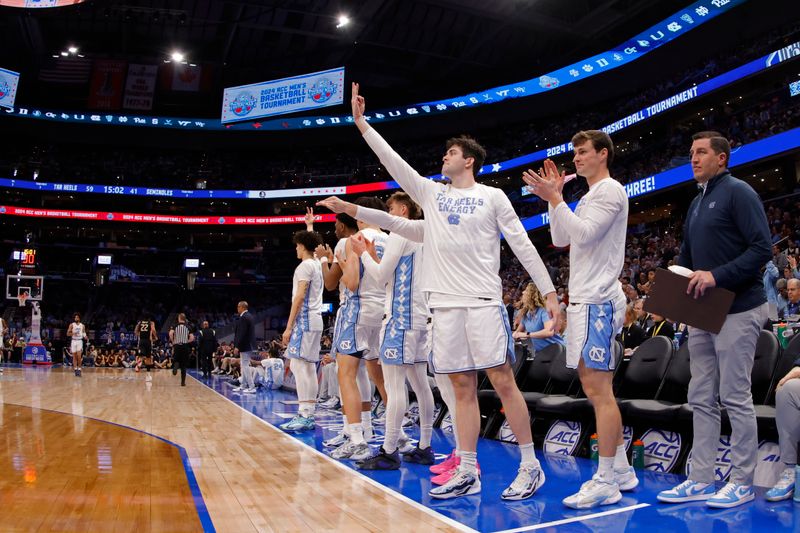 Mar 14, 2024; Washington, D.C., USA; North Carolina players celebrate on the bench against Florida State in the second half at Capital One Arena. Mandatory Credit: Geoff Burke-USA TODAY Sports