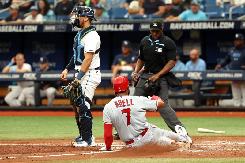 Sep 21, 2023; St. Petersburg, Florida, USA; Los Angeles Angels right fielder Jo Adell (7) slides safe at home as he scores a run against the Tampa Bay Rays during the fourth inning at Tropicana Field. Mandatory Credit: Kim Klement Neitzel-USA TODAY Sports