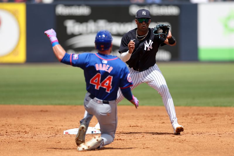 Mar 25, 2024; Tampa, Florida, USA;  New York Yankees shortstop Rodrick Arias (18) attempts to turn a double play against the New York Mets in the third inning at George M. Steinbrenner Field. Mandatory Credit: Nathan Ray Seebeck-USA TODAY Sports