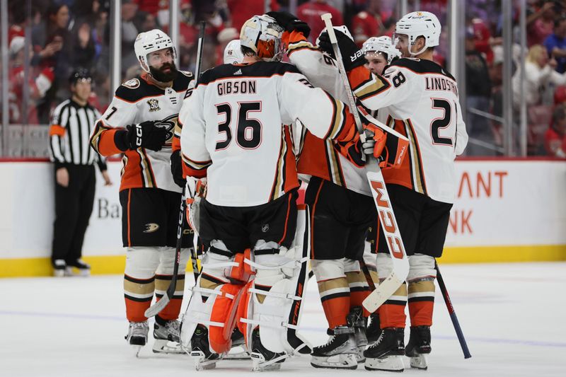 Jan 15, 2024; Sunrise, Florida, USA; Anaheim Ducks goaltender John Gibson (36) celebrates with teammates after winning the game against the Florida Panthers at Amerant Bank Arena. Mandatory Credit: Sam Navarro-USA TODAY Sports