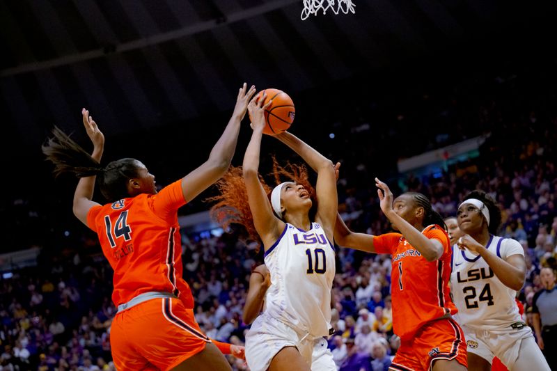 Feb 22, 2024; Baton Rouge, Louisiana, USA; LSU Lady Tigers forward Angel Reese (10) shoots against Auburn Tigers forward Taylen Collins (14) and forward Celia Sumbane (1) during the second half at Pete Maravich Assembly Center. Mandatory Credit: Matthew Hinton-USA TODAY Sports