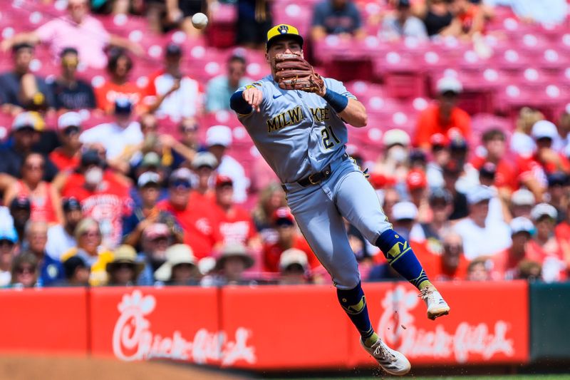 Aug 17, 2025; Cincinnati, Ohio, USA; Milwaukee Brewers third baseman Caleb Durbin (21) throws to first to get Cincinnati Reds shortstop Elly De La Cruz (not pictured) out in the third inning at Great American Ball Park. Mandatory Credit: Katie Stratman-Imagn Images