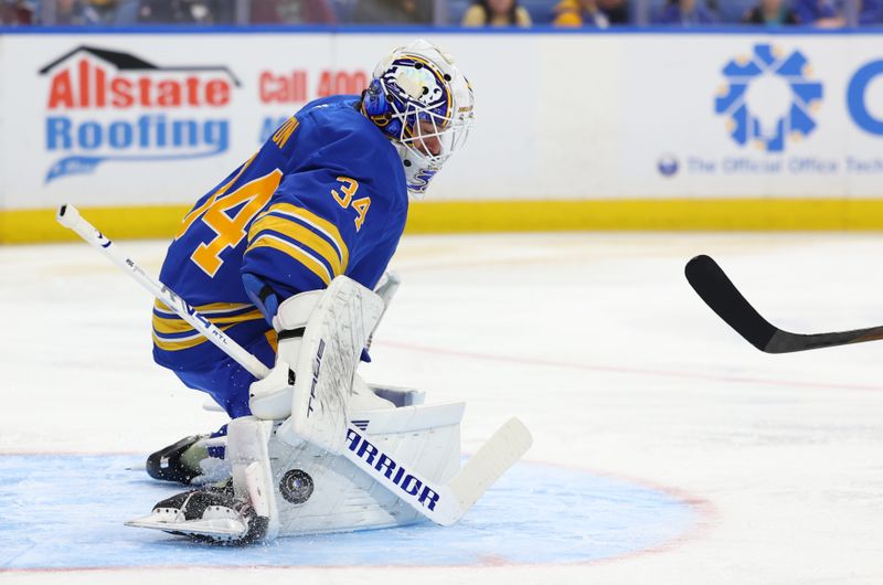 Oct 13, 2025; Buffalo, New York, USA;  Buffalo Sabres goaltender Alex Lyon (34) makes a save during the first period against the Colorado Avalanche at KeyBank Center. Mandatory Credit: Timothy T. Ludwig-Imagn Images