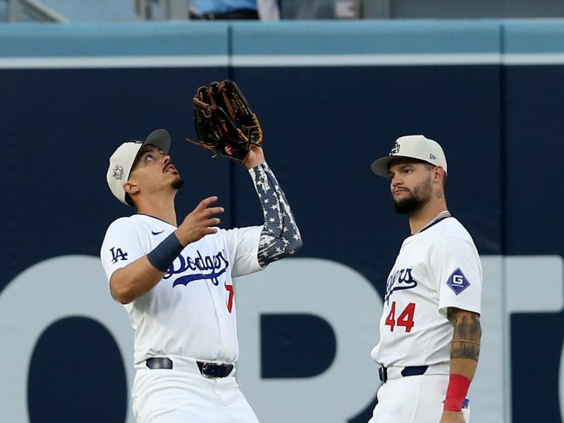 Jul 4, 2024; Los Angeles, California, USA; Los Angeles Dodgers outfielder Miguel Vargas (27) makes a catch in front of outfielder Andy Pages (44) during the fourth inning against the Arizona Diamondbacks at Dodger Stadium. Mandatory Credit: Jason Parkhurst-USA TODAY Sports