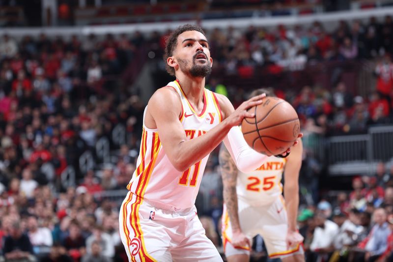 CHICAGO, IL - APRIL 17:  Trae Young #11 of the Atlanta Hawks shoots a free throw during the game  against the Chicago Bulls during the 2024 Play-In Tournament  on April 17, 2024 at United Center in Chicago, Illinois. NOTE TO USER: User expressly acknowledges and agrees that, by downloading and or using this photograph, User is consenting to the terms and conditions of the Getty Images License Agreement. Mandatory Copyright Notice: Copyright 2024 NBAE (Photo by Jeff Haynes/NBAE via Getty Images)