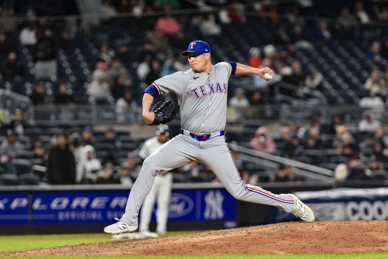 May 21, 2025; Bronx, New York, USA; Texas Rangers pitcher Robert Garcia (62) pitches against the New York Yankees during the eighth inning at Yankee Stadium. Mandatory Credit: John Jones-Imagn Images